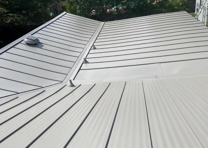 Solar attic fan installed on a metal roof for Roof Ventilation in Merchantville